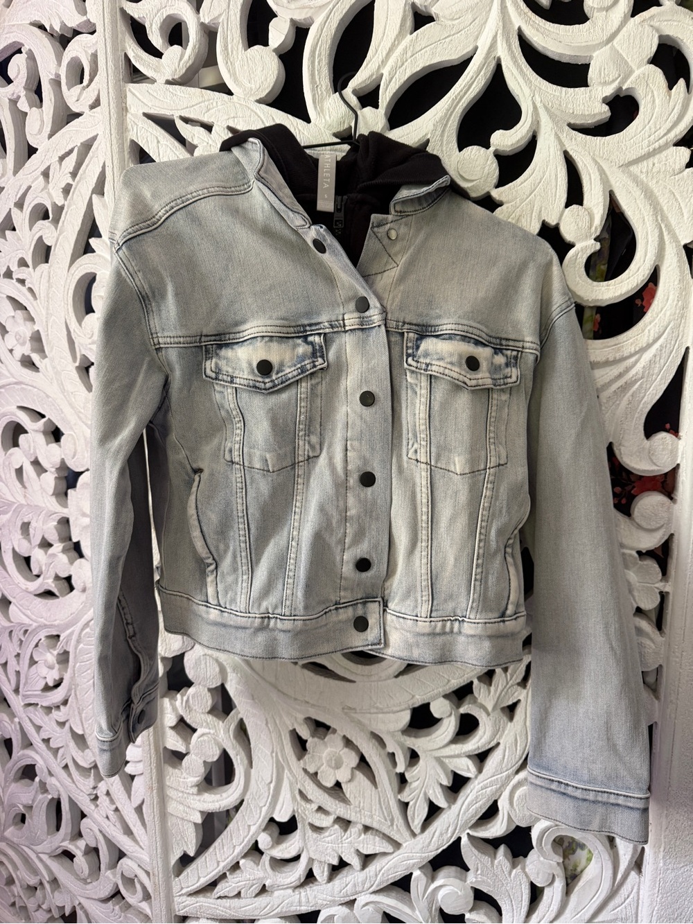 Woman light blue stretch Jean jacket with black hood lots of pockets comfortable